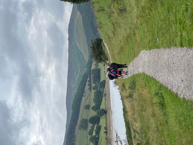 A shot of the group in the distance along a zig-zagging gravel path
not too far from the reservoir edge